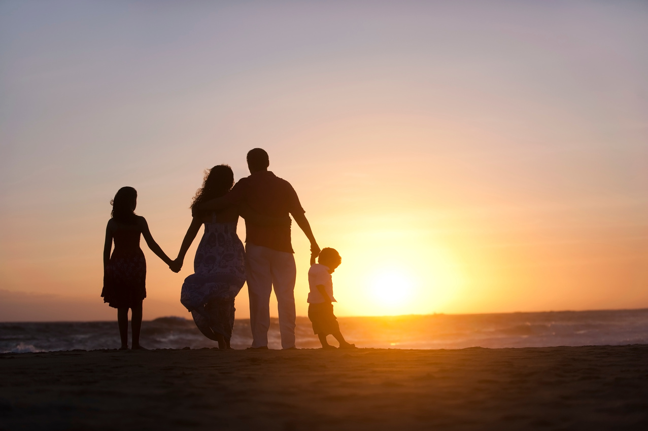 Family watching the sunset