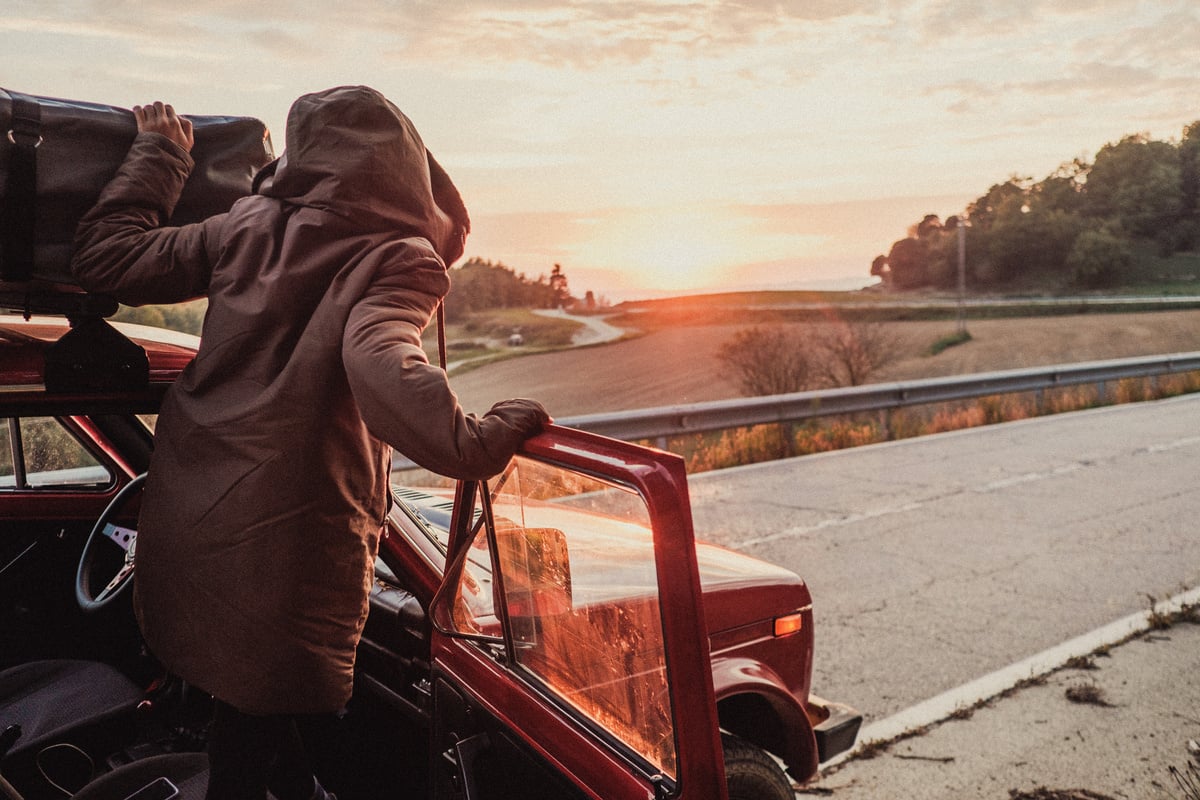 Man Checking Items During Road Trip